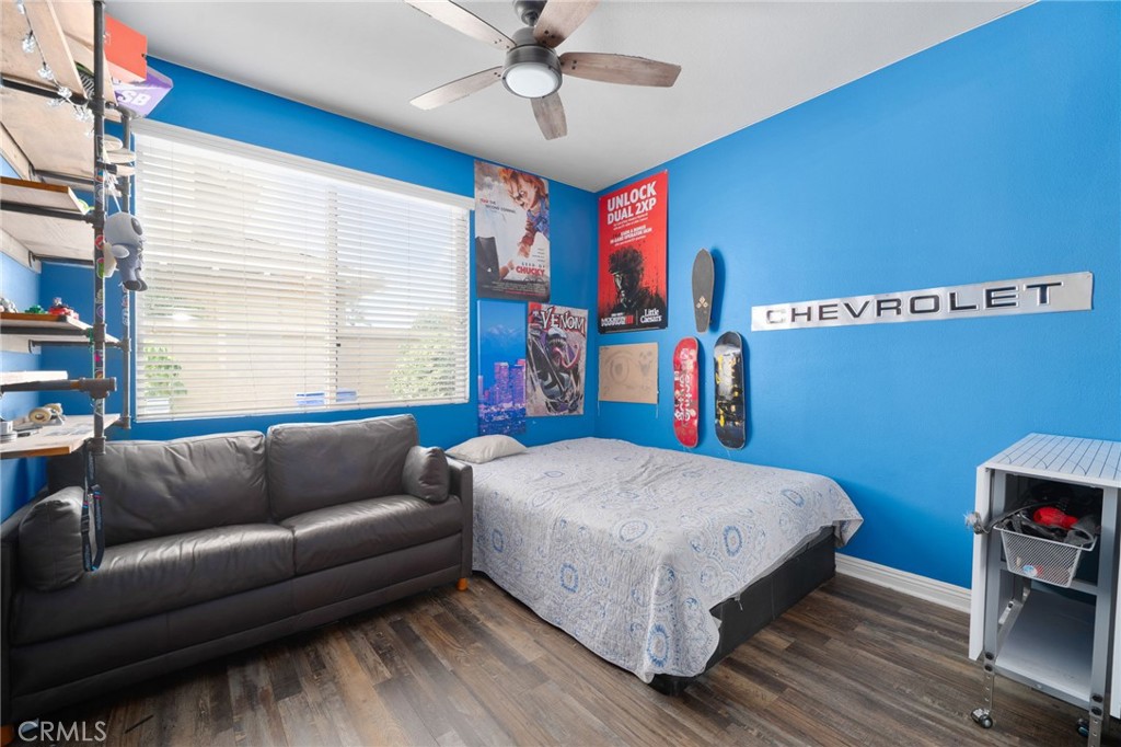 14113 Los Robles Court Rancho Cucamonga, CA 91739 - Photo 26 of 33 a bedroom with a bed couch and a window