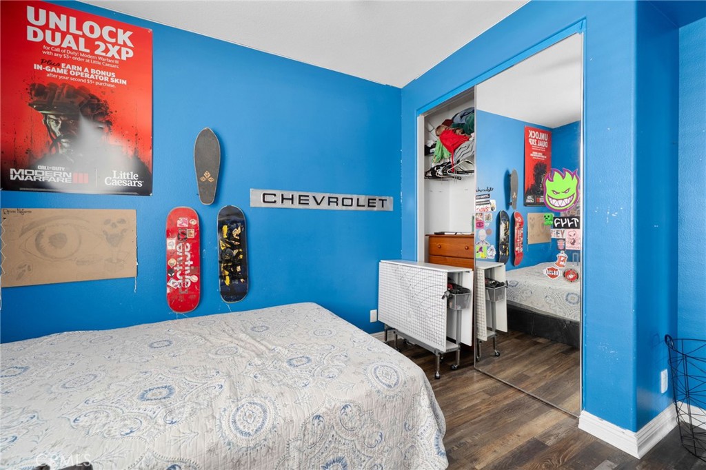14113 Los Robles Court Rancho Cucamonga, CA 91739 - Photo 27 of 33 a bedroom with bed and wooden floor
