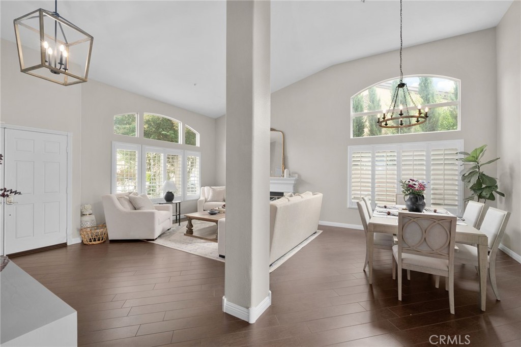 14113 Los Robles Court Rancho Cucamonga, CA 91739 - Photo 8 of 33 a view of a dining room with furniture wooden floor and chandelier