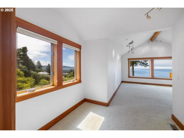 a bathroom with a tub sink mirror and a shower