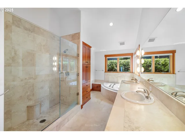 a bathroom with a bathtub and window