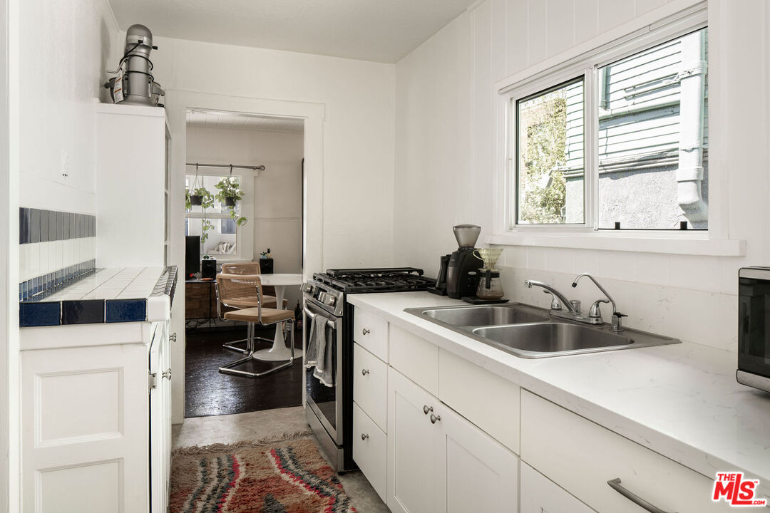 754 California Avenue Venice, CA 90291 - Photo 30 of 34 a kitchen with a sink cabinets and window
