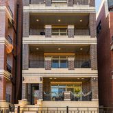 a front view of a building with glass windows