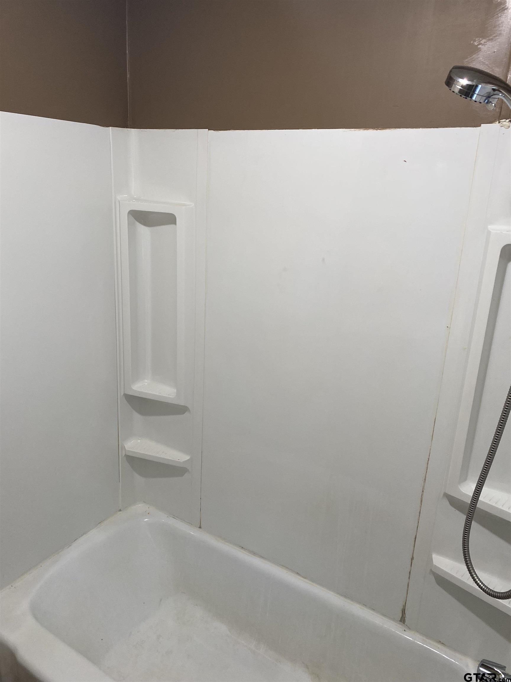 502 3rd Street Quitman, TX 75783 - Photo 15 of 22 a view of small space with racks on the wall