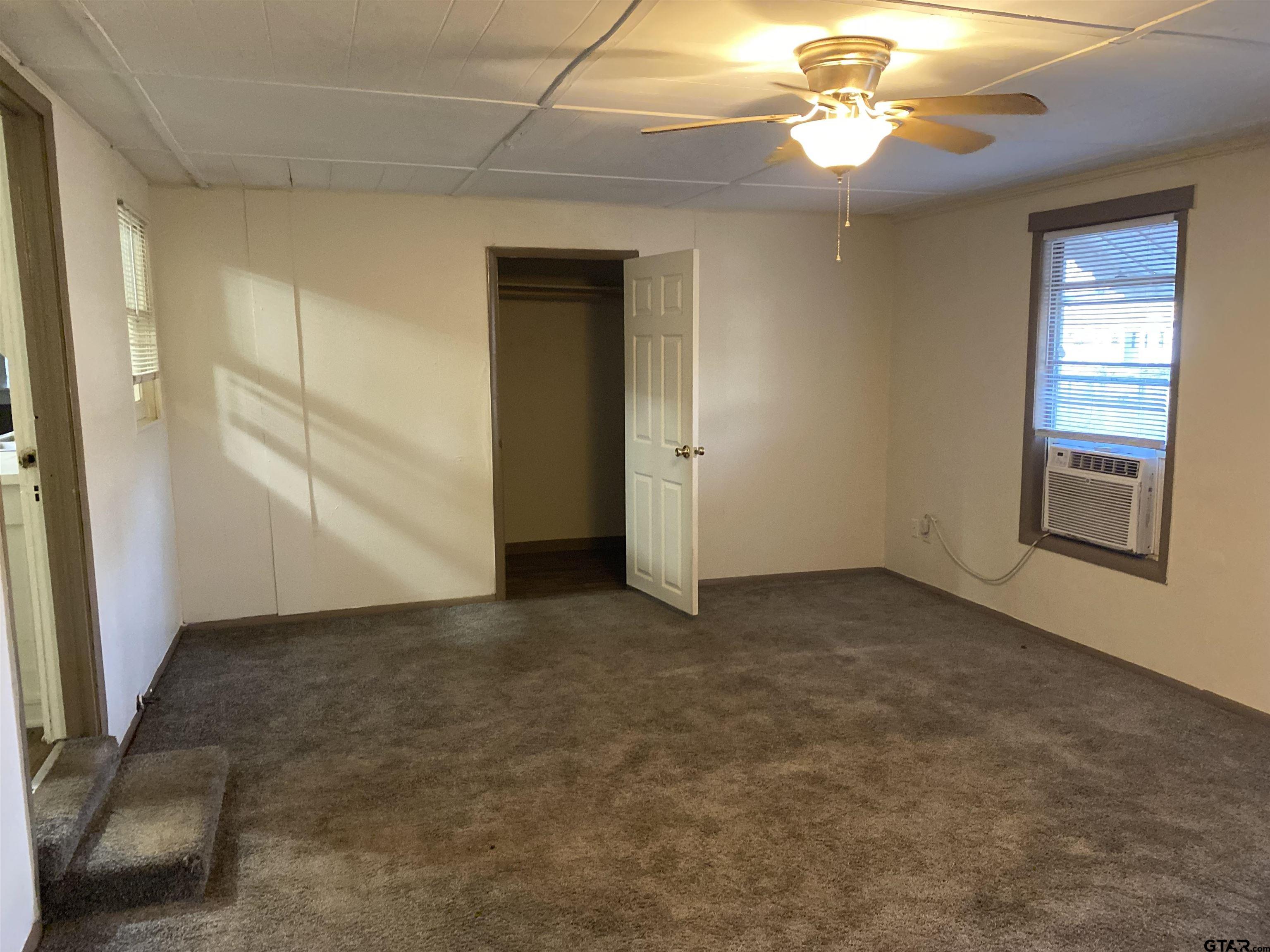 502 3rd Street Quitman, TX 75783 - Photo 20 of 22 a view of an empty room with a window