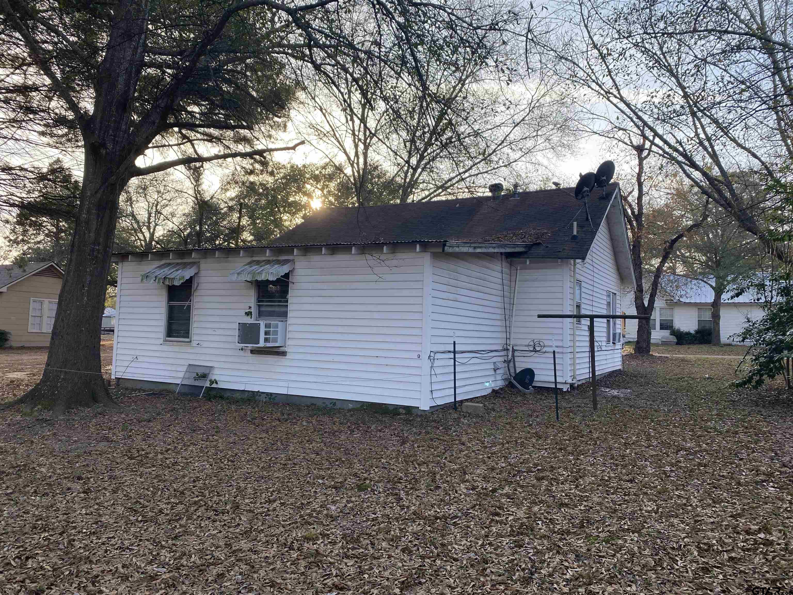 502 3rd Street Quitman, TX 75783 - Photo 4 of 22 a view of a house with a yard