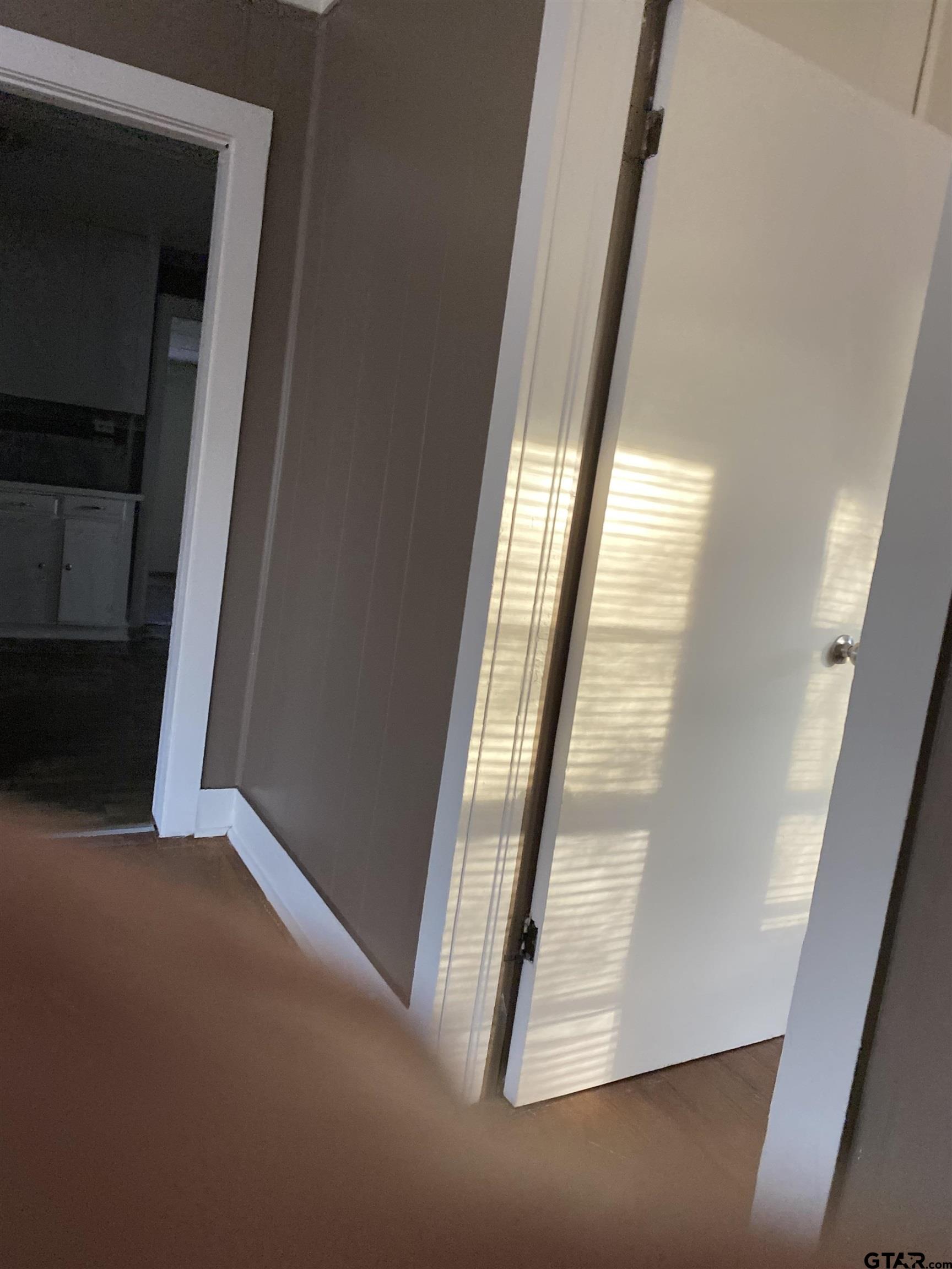 502 3rd Street Quitman, TX 75783 - Photo 8 of 22 a view of an empty room with a fireplace