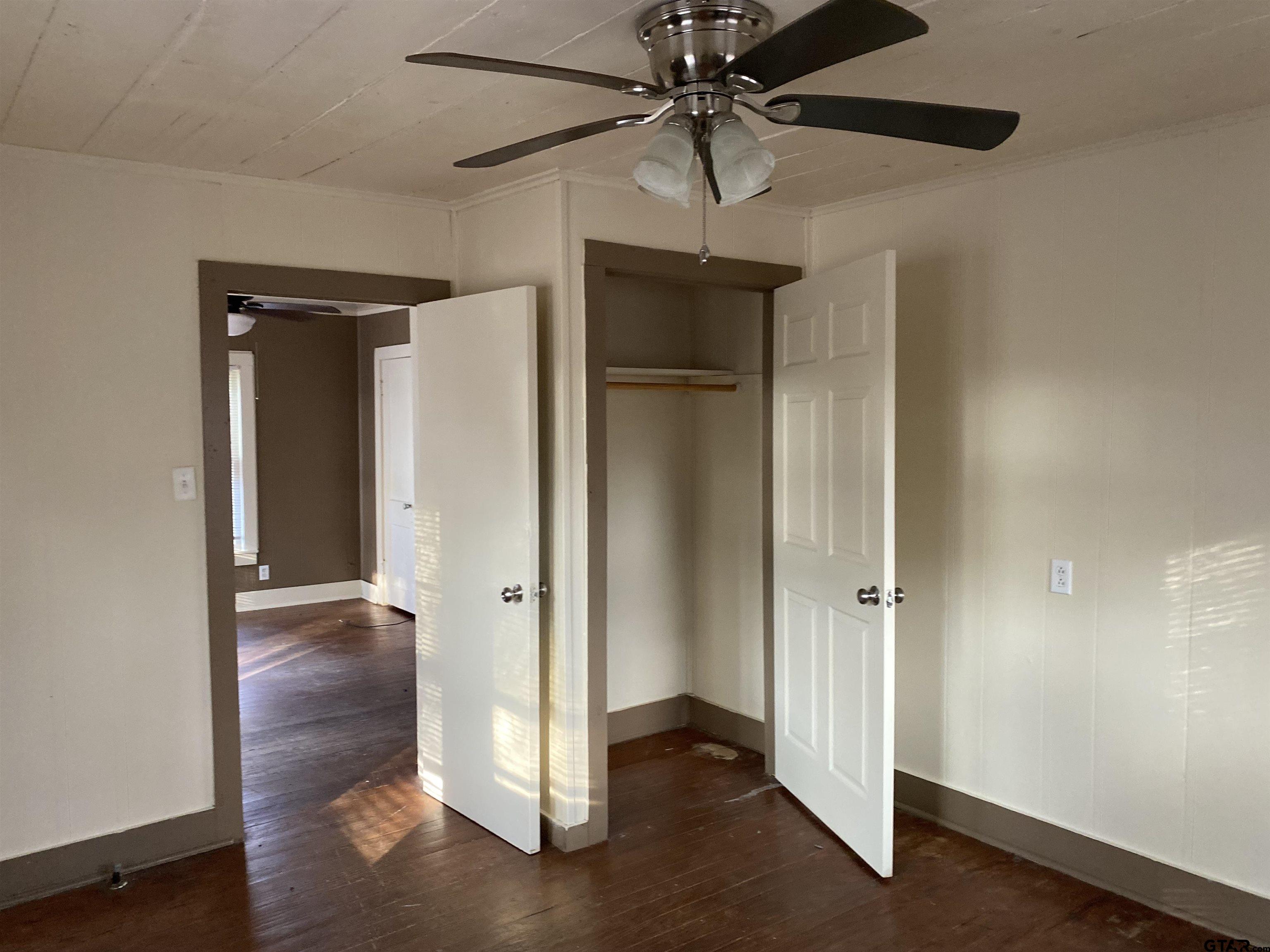 502 3rd Street Quitman, TX 75783 - Photo 10 of 22 wooden floor in an empty room