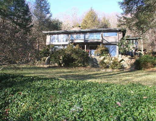 42 Fern Valley Road Weston, CT 06883 - Photo 1 of 1 a front view of a house with garden