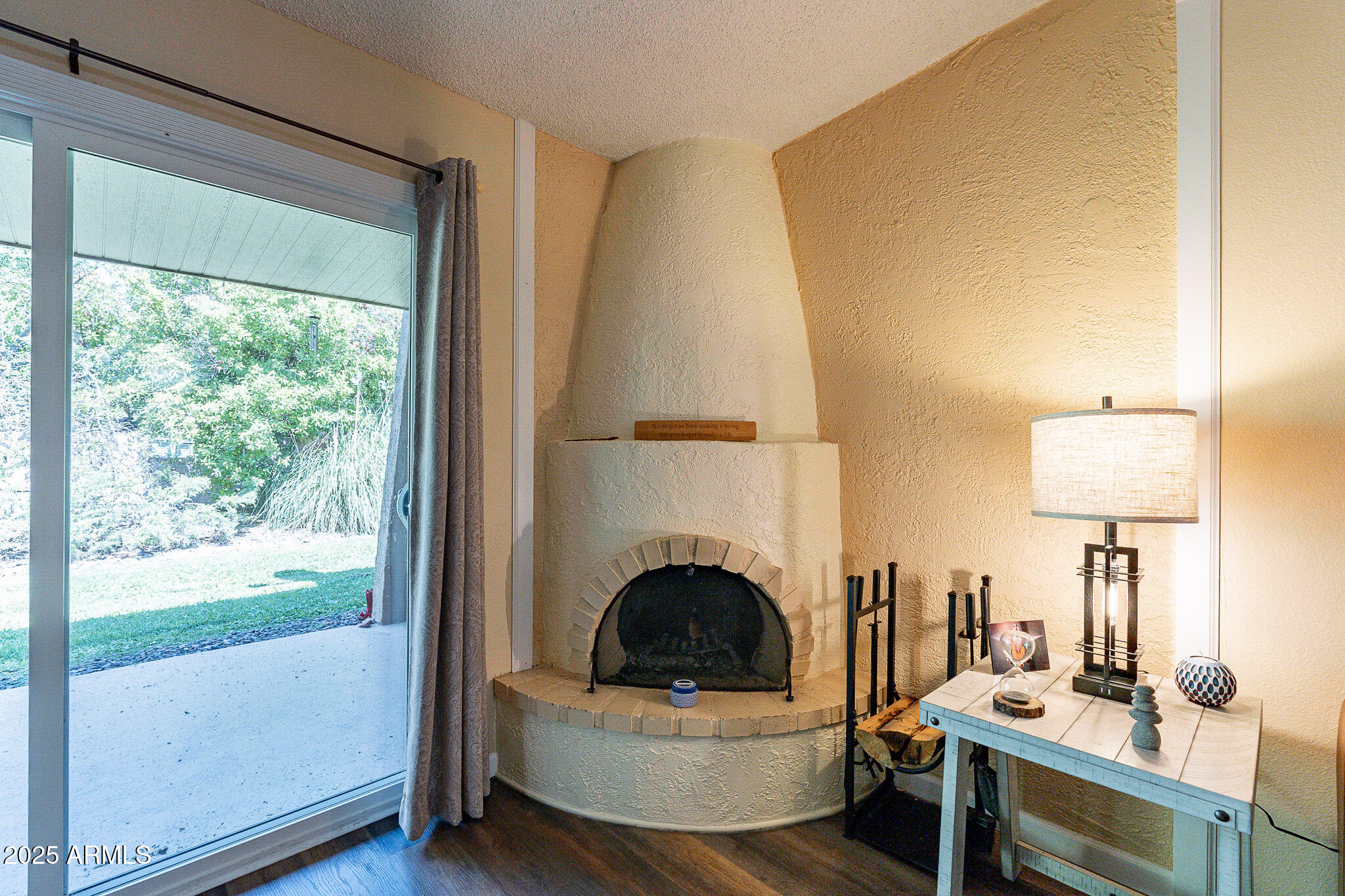 130 Castle Rock Road, Unit 100 Sedona, AZ 86351 - Photo 11 of 36 a living room with furniture and a fireplace