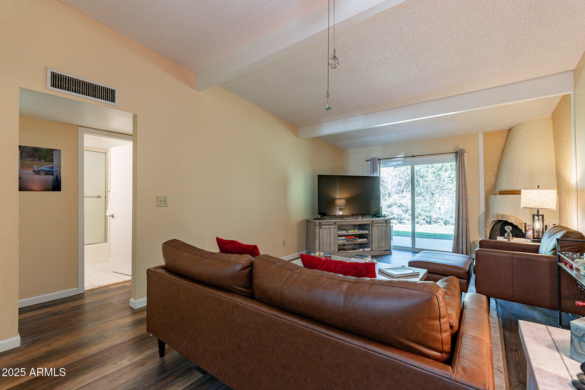 130 Castle Rock Road, Unit 100 Sedona, AZ 86351 - Photo 5 of 36 a living room with furniture and a flat screen tv