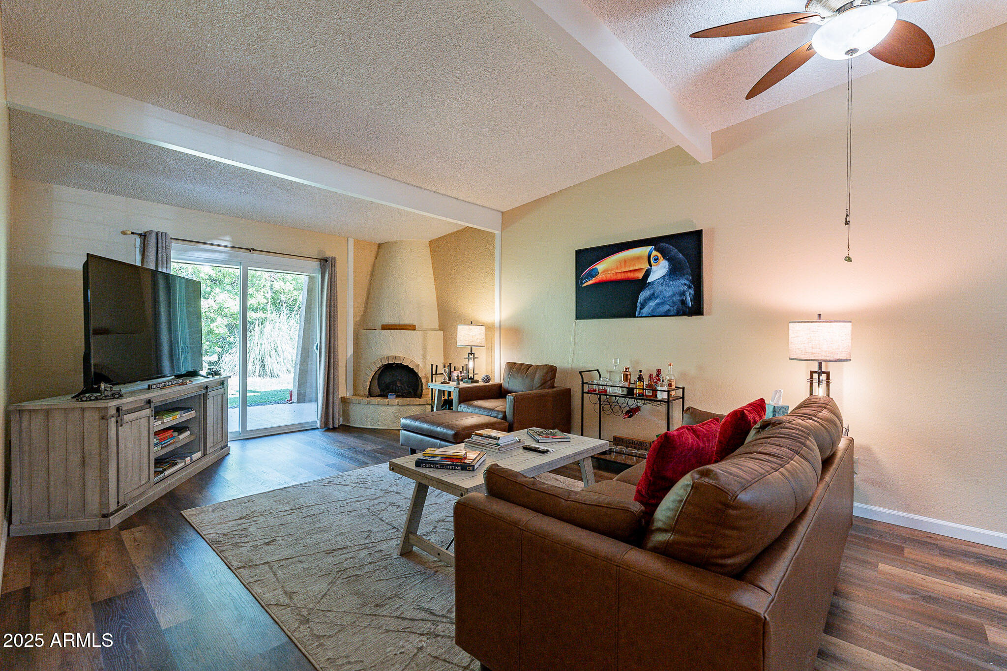 130 Castle Rock Road, Unit 100 Sedona, AZ 86351 - Photo 6 of 36 a living room with furniture a flat screen tv and a large window