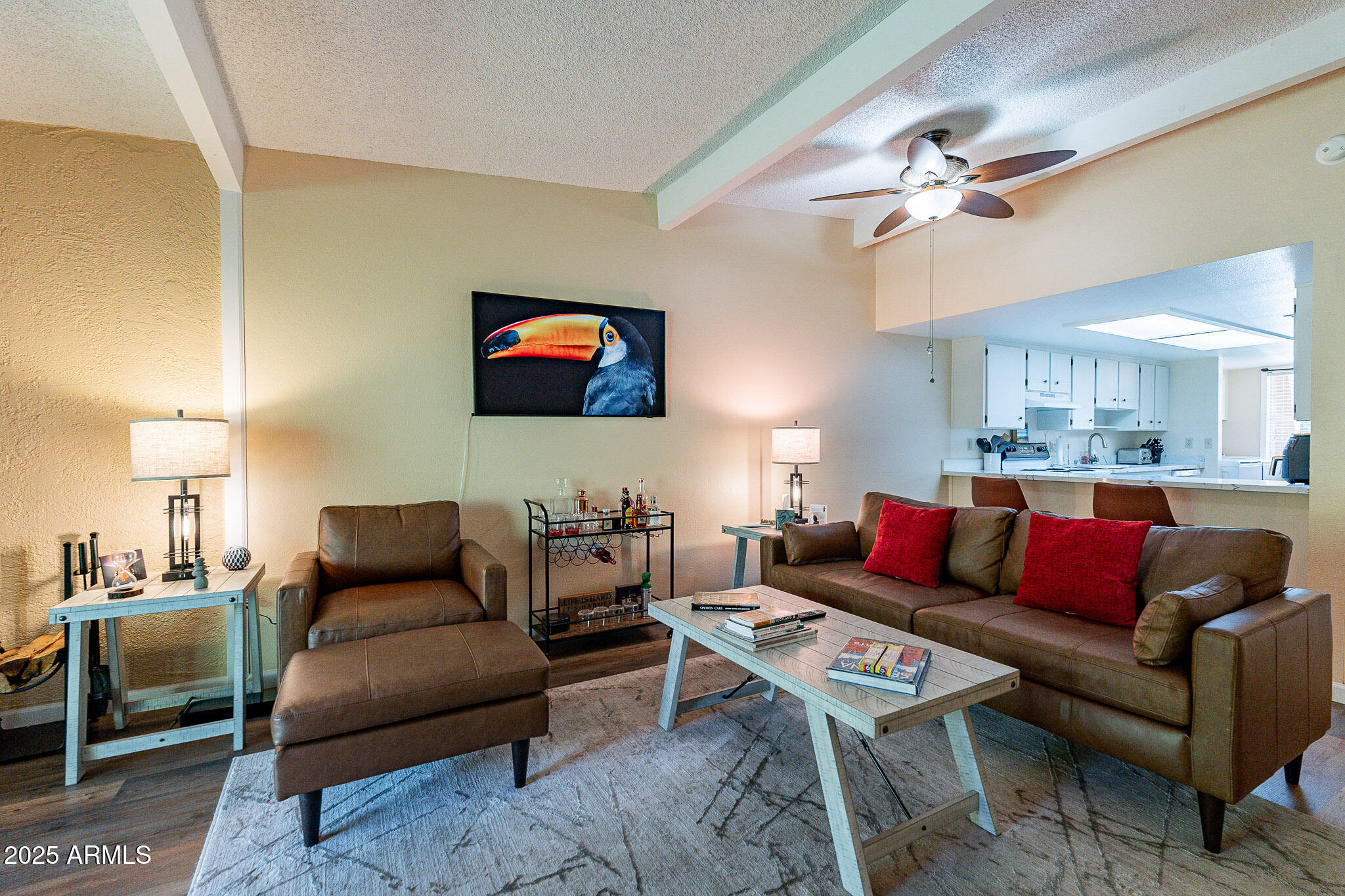 130 Castle Rock Road, Unit 100 Sedona, AZ 86351 - Photo 7 of 36 a living room with furniture a rug and a flat screen tv