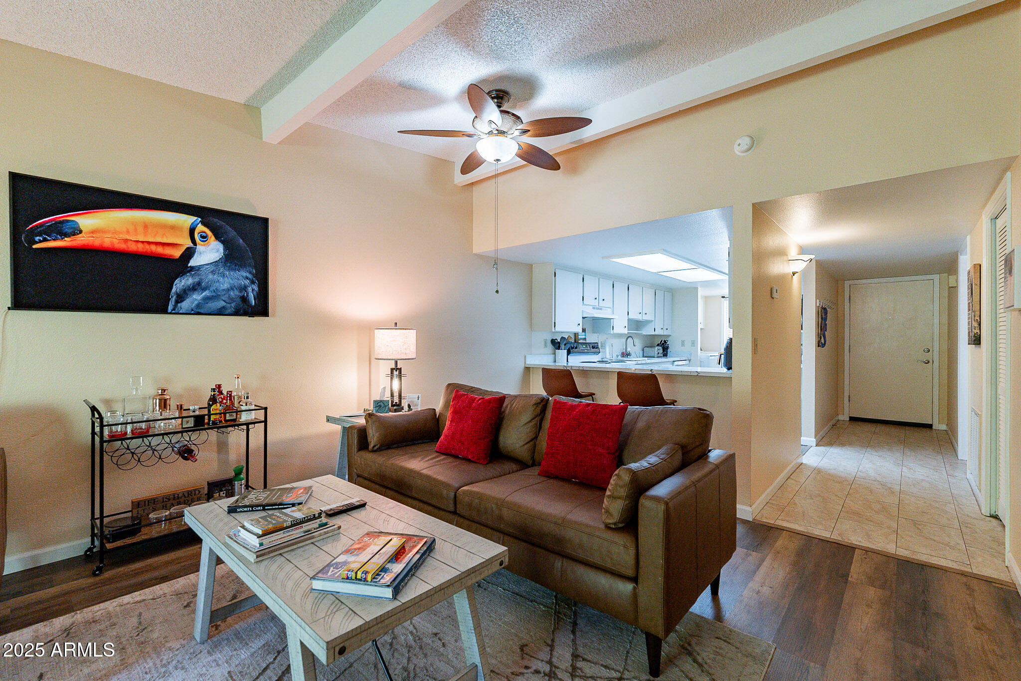 130 Castle Rock Road, Unit 100 Sedona, AZ 86351 - Photo 8 of 36 a living room with furniture and a wooden floor