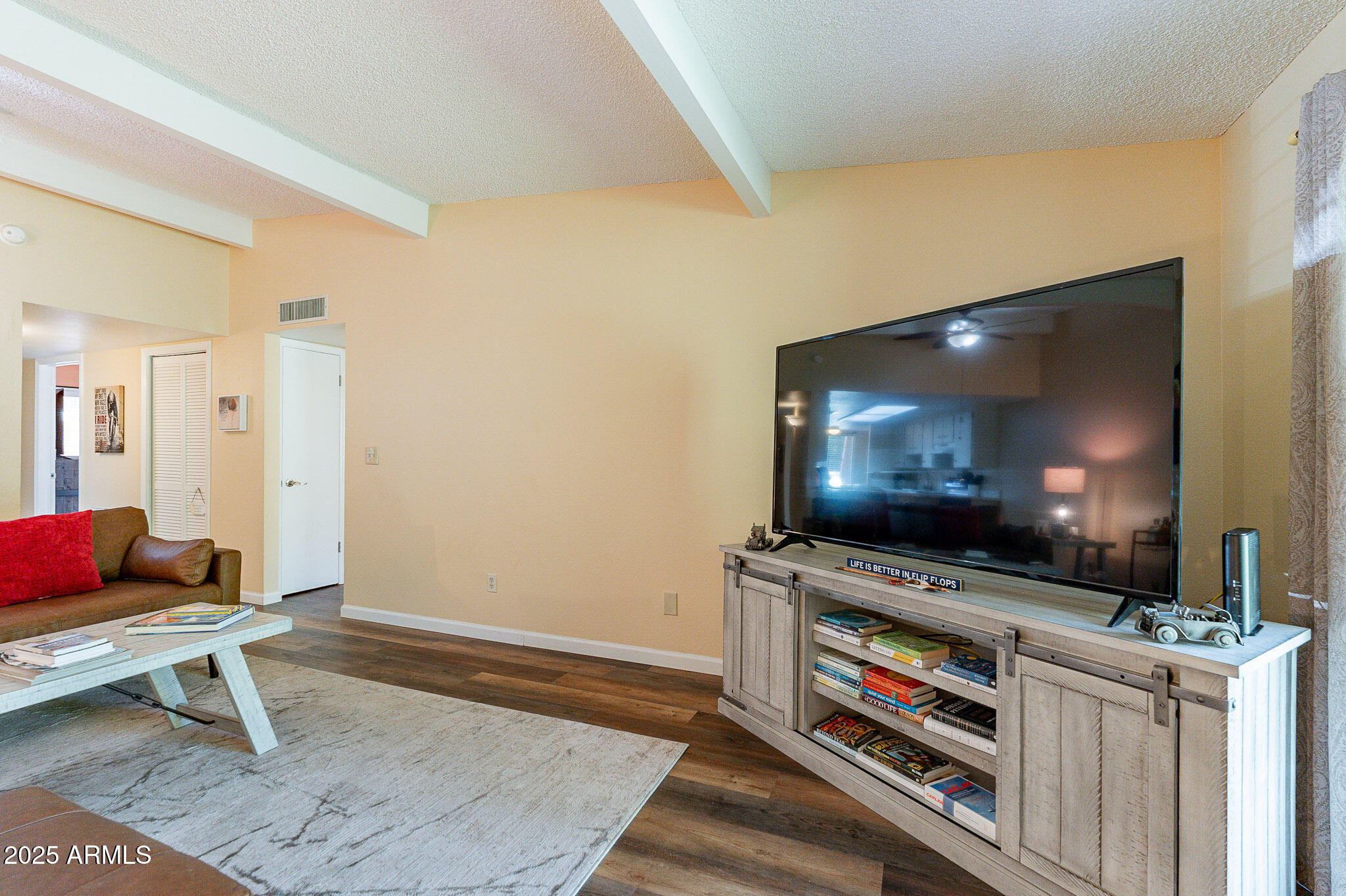 130 Castle Rock Road, Unit 100 Sedona, AZ 86351 - Photo 10 of 36 a living room with furniture and a flat screen tv