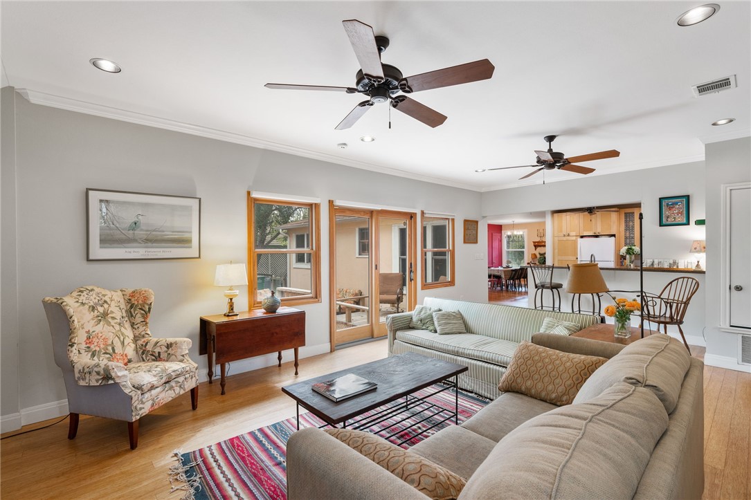 The stunning family room addition also offers elegant crown molding and recessed lighting.