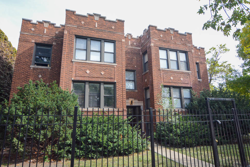 3301 North Harding Avenue, Unit 1E Chicago, IL 60618 - Photo 1 of 21 a front view of a house with a garden