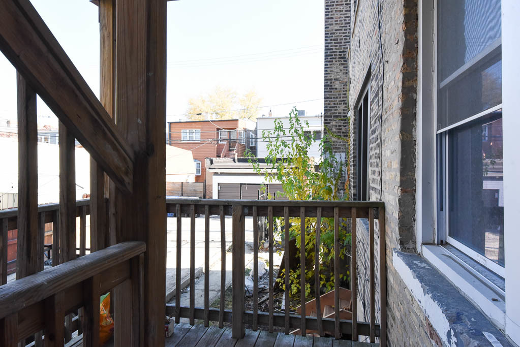 3301 North Harding Avenue, Unit 1E Chicago, IL 60618 - Photo 21 of 21 a view of a balcony with wooden floor