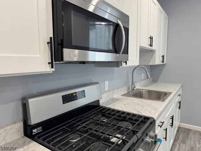 a kitchen with a stove and a sink