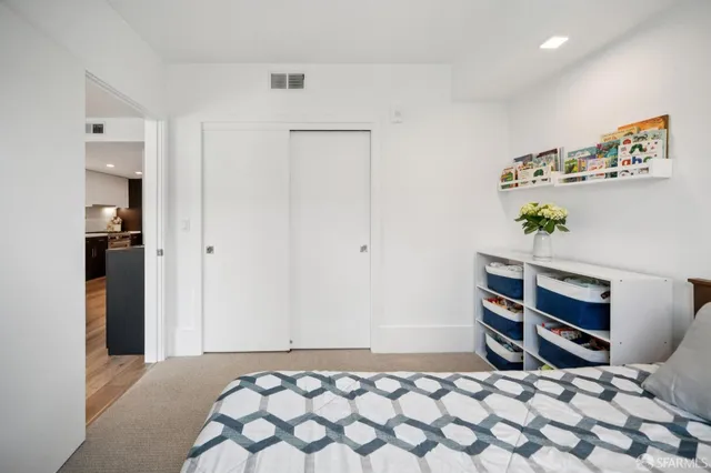 a bathroom with a bathtub shower sink vanity and toilet