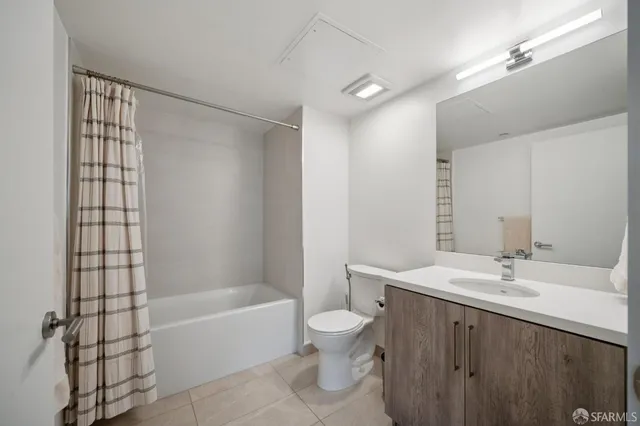 a bathroom with a bathtub and a toilet
