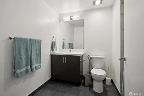 a bedroom with a bed and a flat tv screen