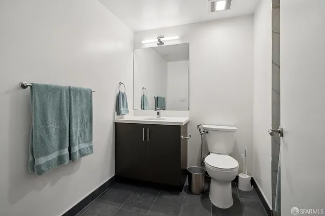 a bedroom with a bed and a flat tv screen