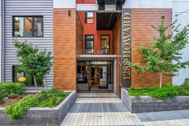 a bathroom with a glass door shower