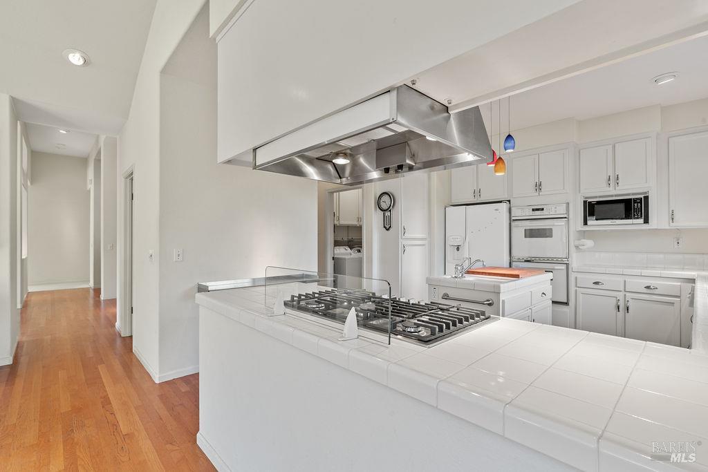 6271 Meadowstone Drive Santa Rosa, CA 95409 - Photo 14 of 24 a kitchen with stainless steel appliances a stove refrigerator and cabinets