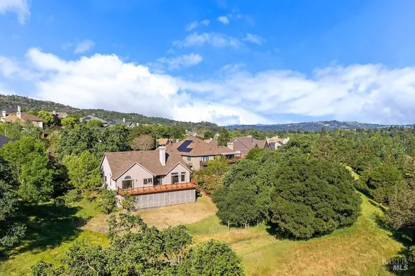 a view of a balcony with wooden floor