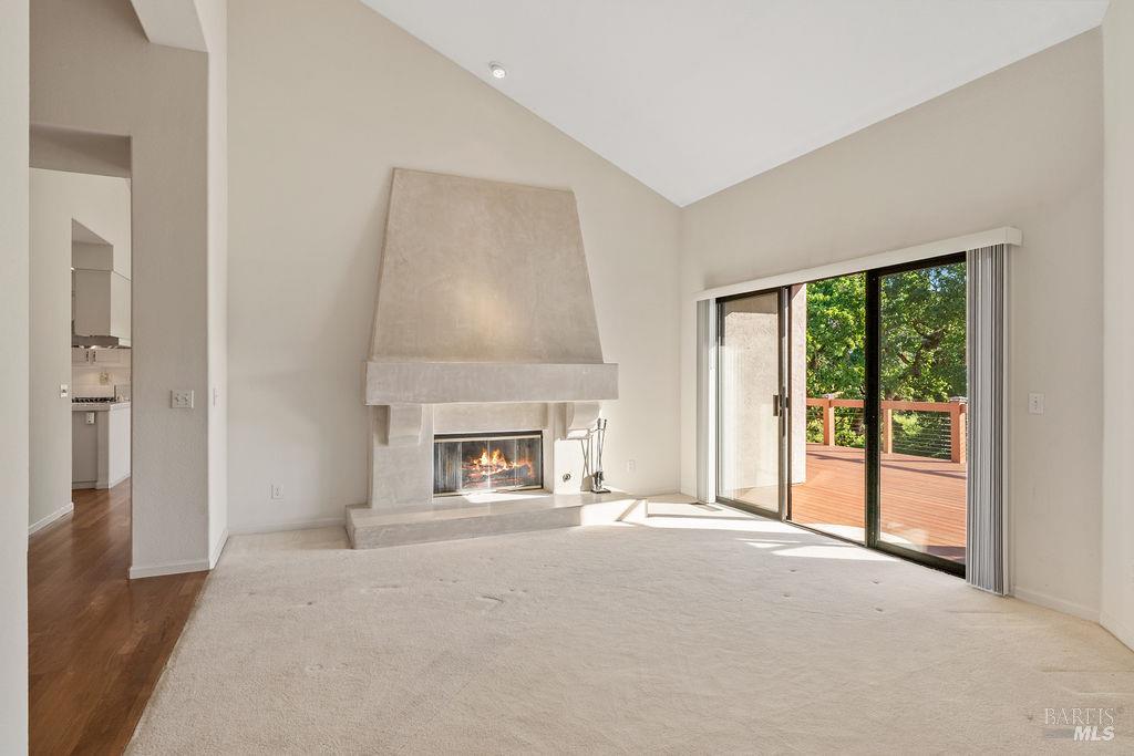 6271 Meadowstone Drive Santa Rosa, CA 95409 - Photo 6 of 24 a view of an empty room with a fireplace and a window