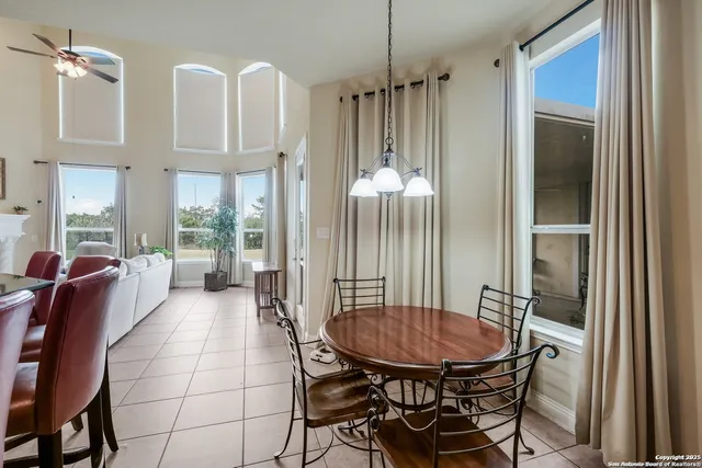 a view of a livingroom with furniture and windows