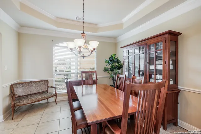 a view of a dining room with furniture window and outside view