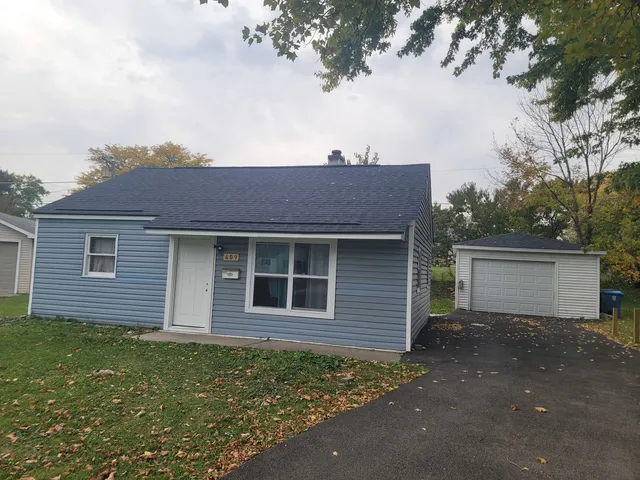 a house view with a backyard space