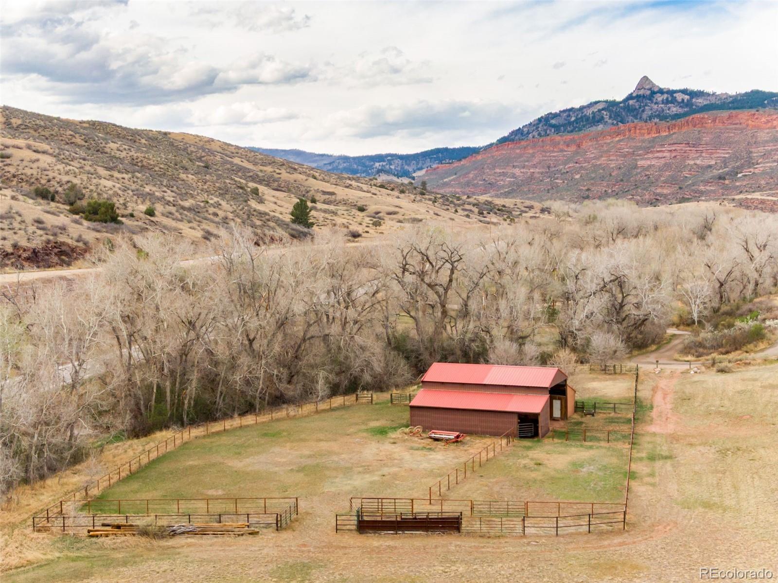 7050 Milner Mountain Ranch Road Fort Collins, CO 80526 - Photo 8 of 50 a view of wooden floor and a mountain view