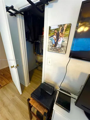 a view of a field with a tree