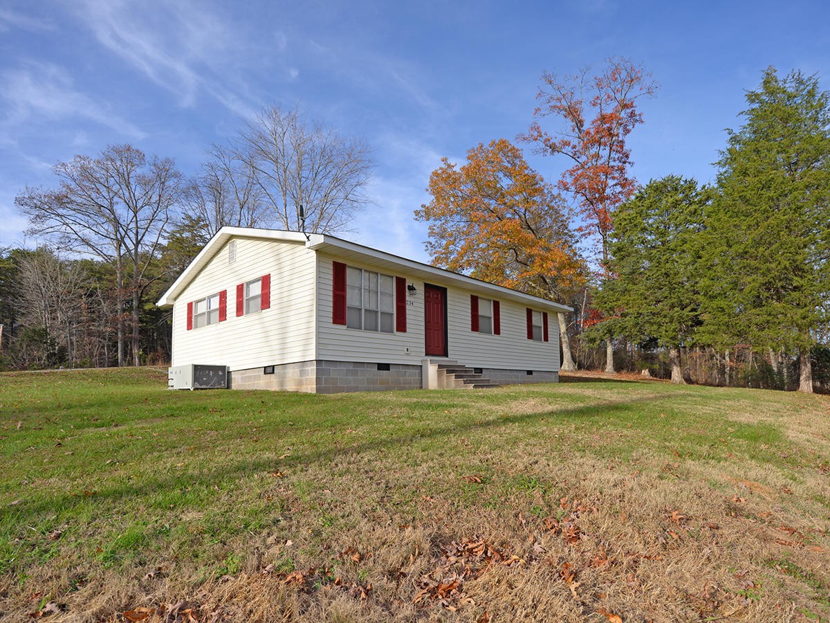 234 Evans Road Kingston, TN 37763 - Photo 1 of 12 a front view of a house with a yard