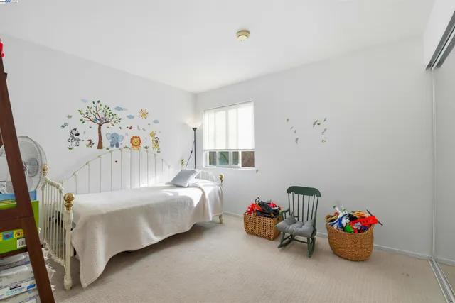 a bedroom with furniture and a bed