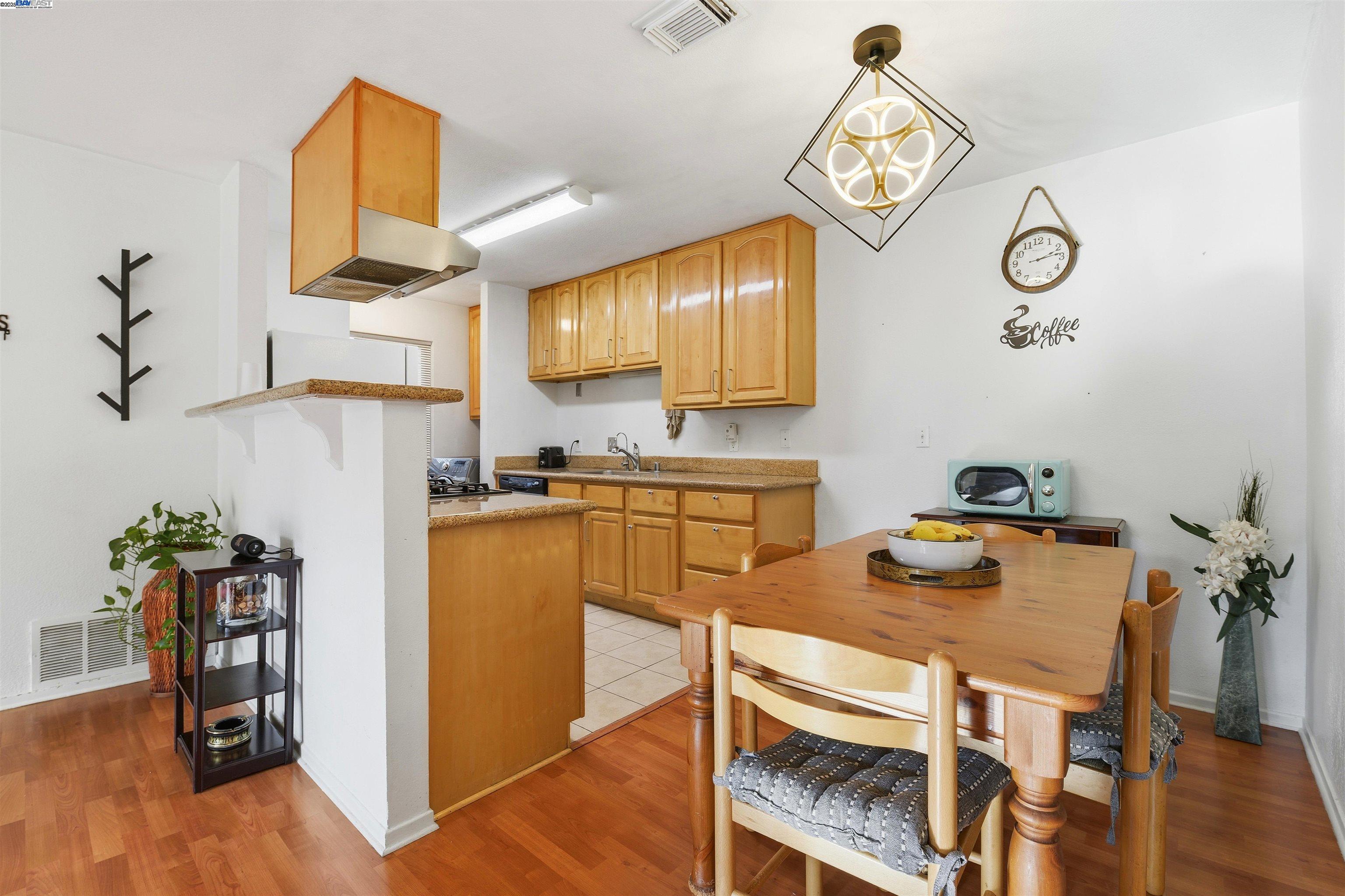 2131 Lakeview Circle Pittsburg, CA 94565 - Photo 6 of 24 a kitchen with a table and chairs in it