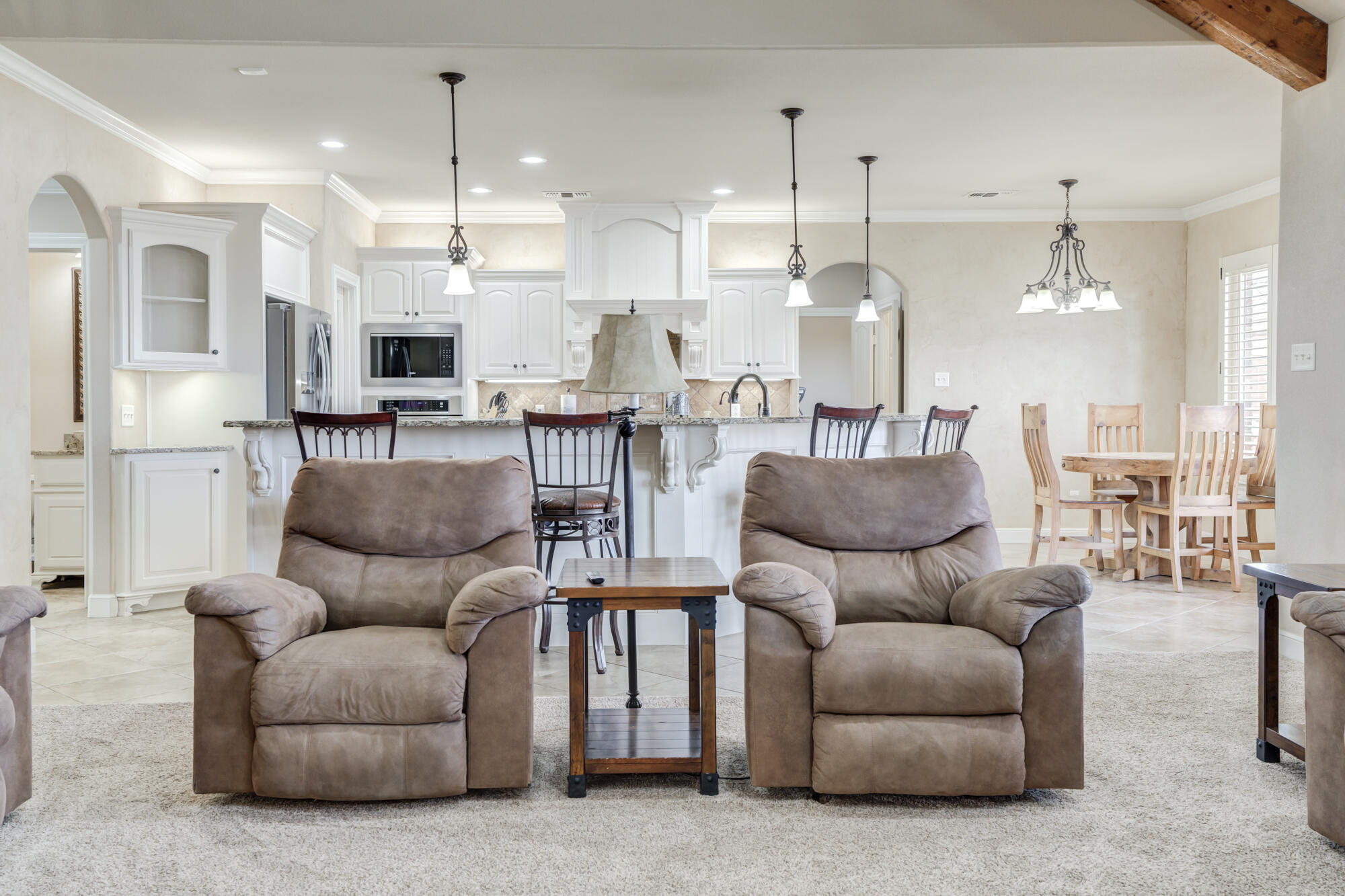 3206 County Road 7610 Lubbock, TX 79423 - Photo 13 of 93 a living room with furniture kitchen and a chandelier