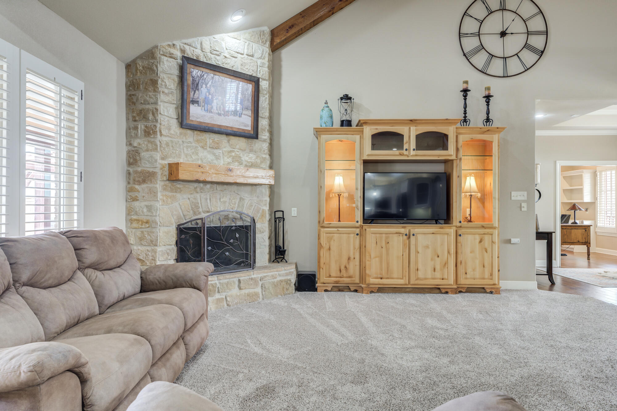 3206 County Road 7610 Lubbock, TX 79423 - Photo 16 of 93 a living room with furniture and a fireplace