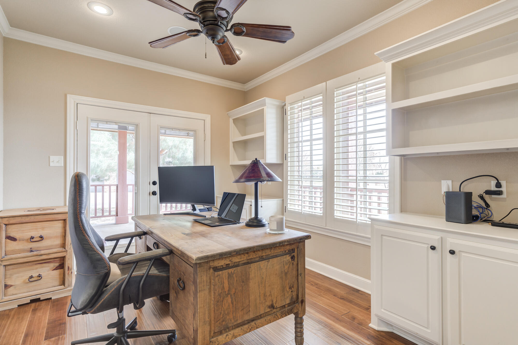 3206 County Road 7610 Lubbock, TX 79423 - Photo 37 of 93 a view of a workspace with furniture and a window