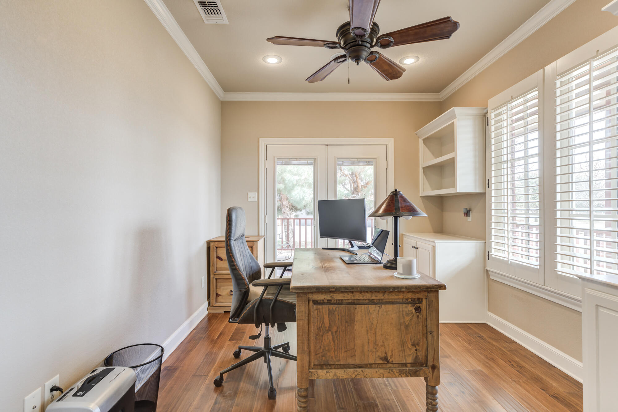 3206 County Road 7610 Lubbock, TX 79423 - Photo 38 of 93 a view of a workspace with furniture and a window
