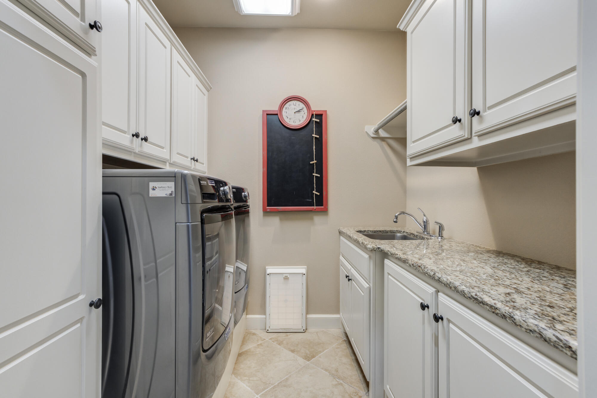 3206 County Road 7610 Lubbock, TX 79423 - Photo 56 of 93 a view of a storage and utility room with washer and dryer
