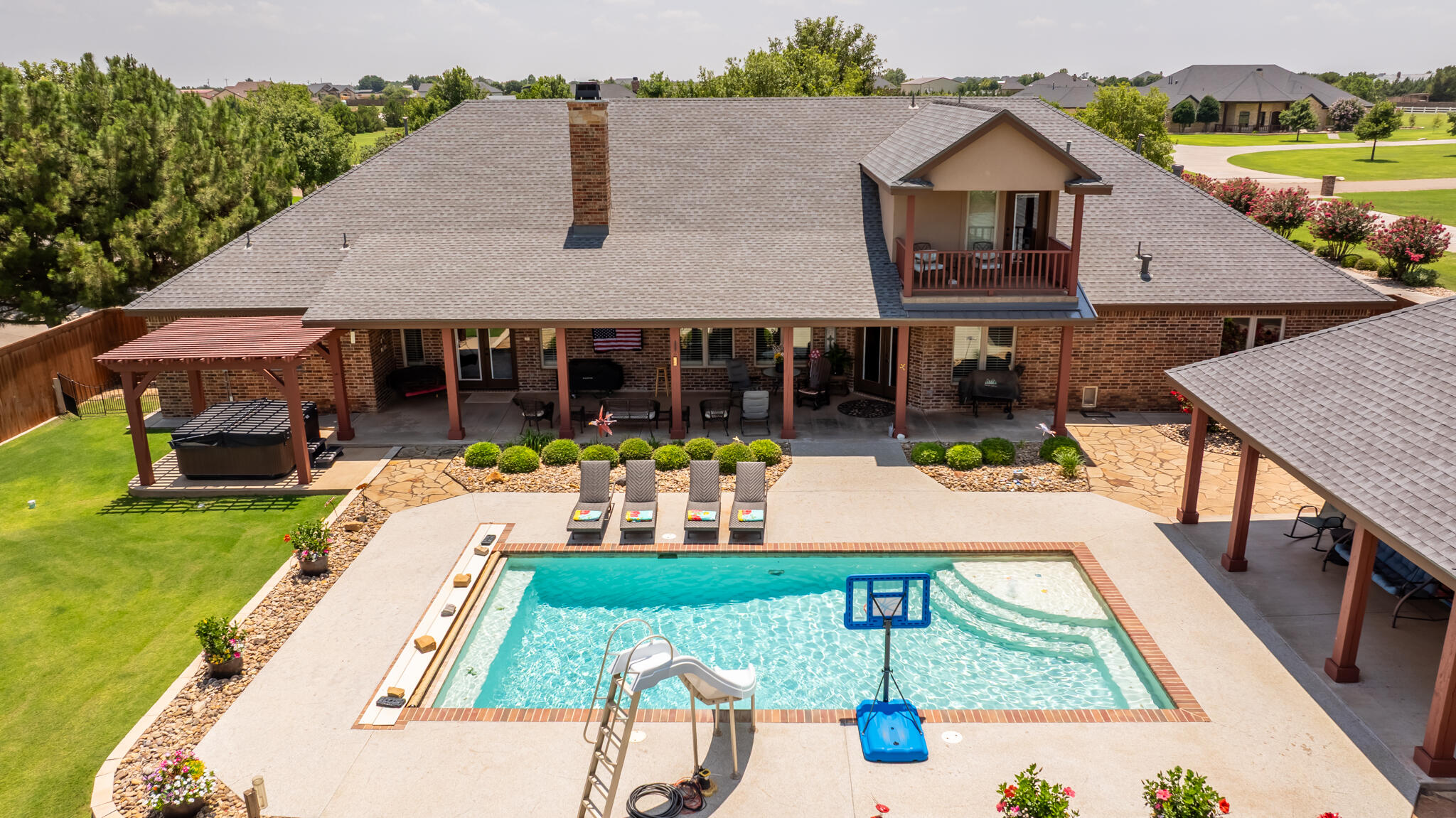 3206 County Road 7610 Lubbock, TX 79423 - Photo 71 of 93 an aerial view of a house with swimming pool and patio