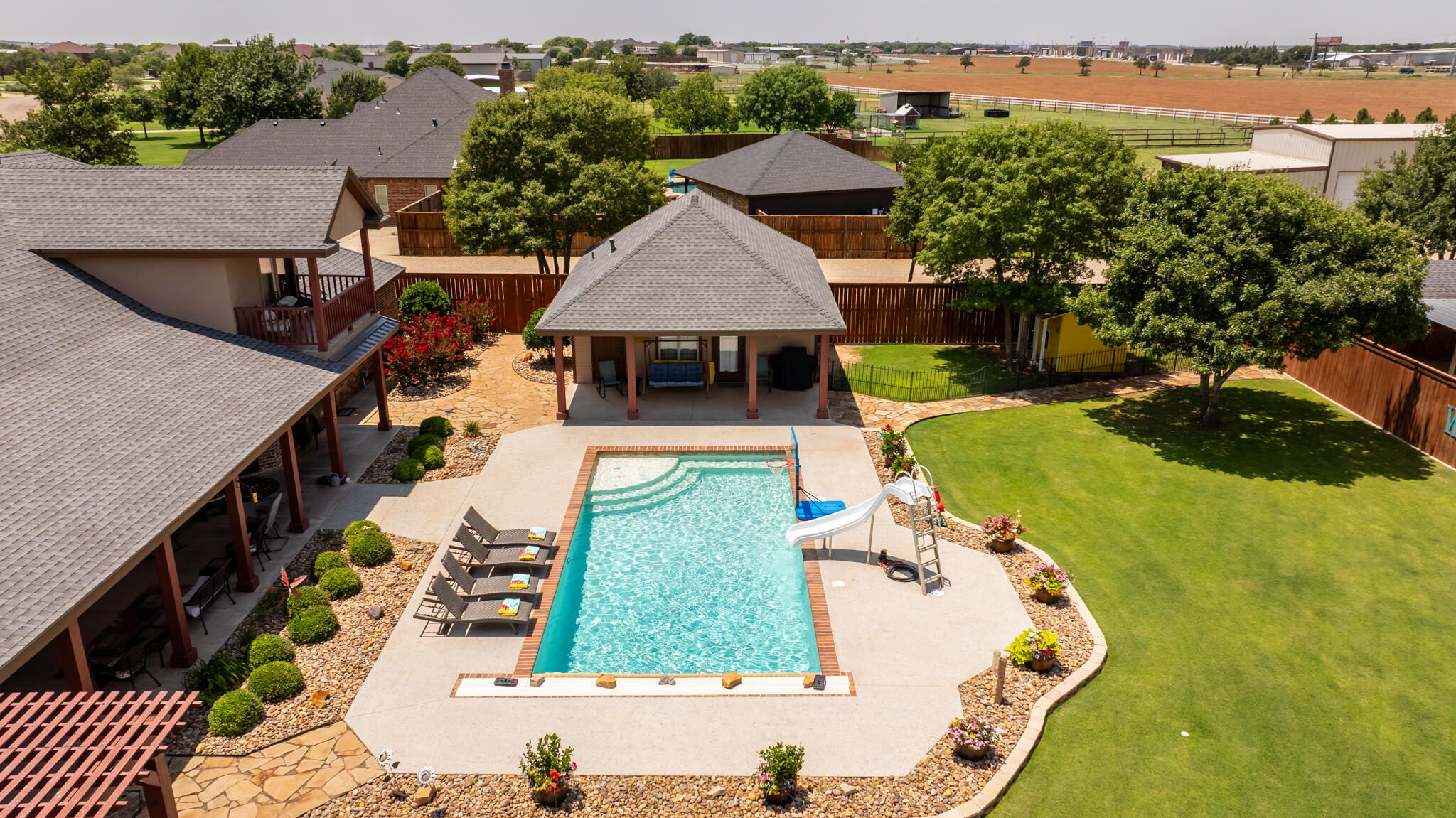 3206 County Road 7610 Lubbock, TX 79423 - Photo 72 of 93 an aerial view of a house with yard swimming pool and outdoor seating