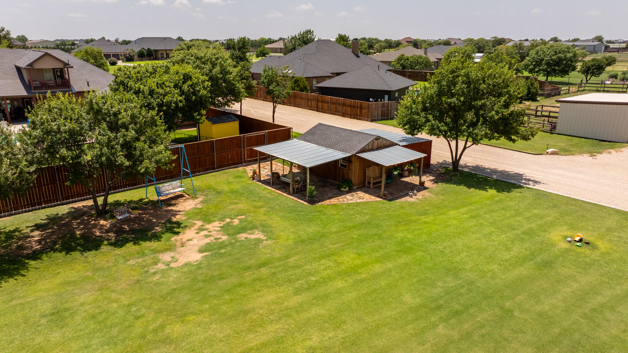 3206 County Road 7610 Lubbock, TX 79423 - Photo 87 of 93 an aerial view of a house with a garden and swimming pool
