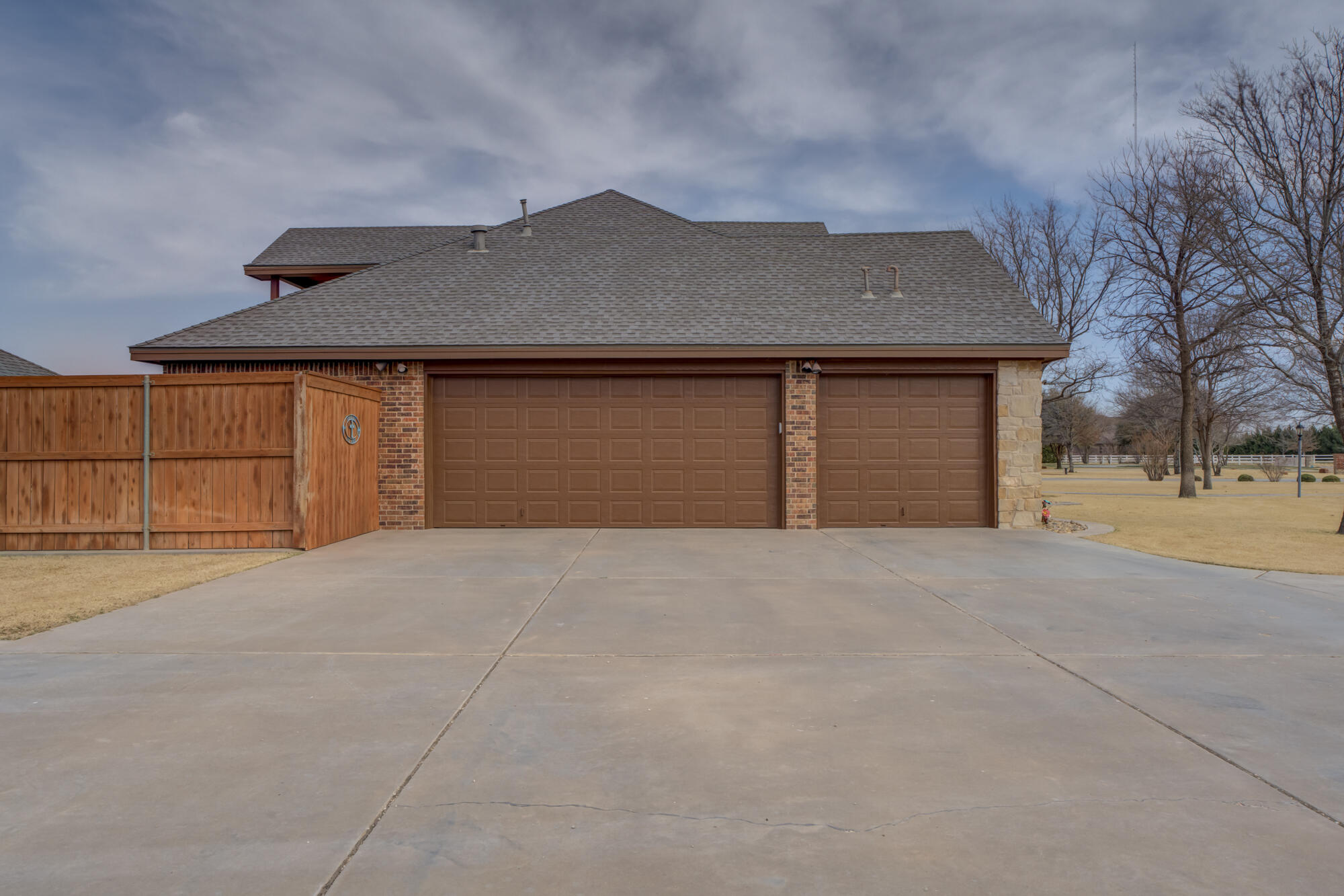 3206 County Road 7610 Lubbock, TX 79423 - Photo 93 of 93 a front view of a house with a yard and garage