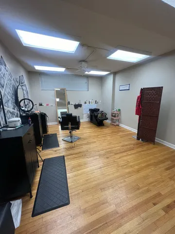 a bed room with furniture and a wooden floor