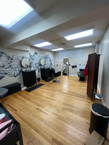 a room with furniture pool table and musical instruments